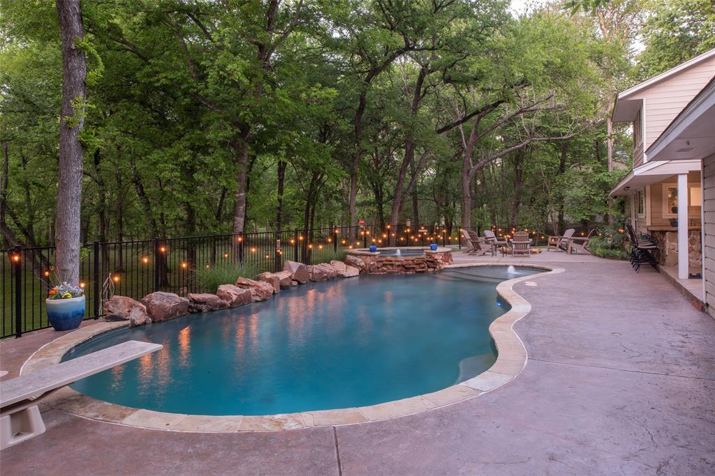1451 Meandro Ria Lane Fairview, TX 75069 - Photo 38 of 38 a view of a swimming pool with outdoor seating and trees