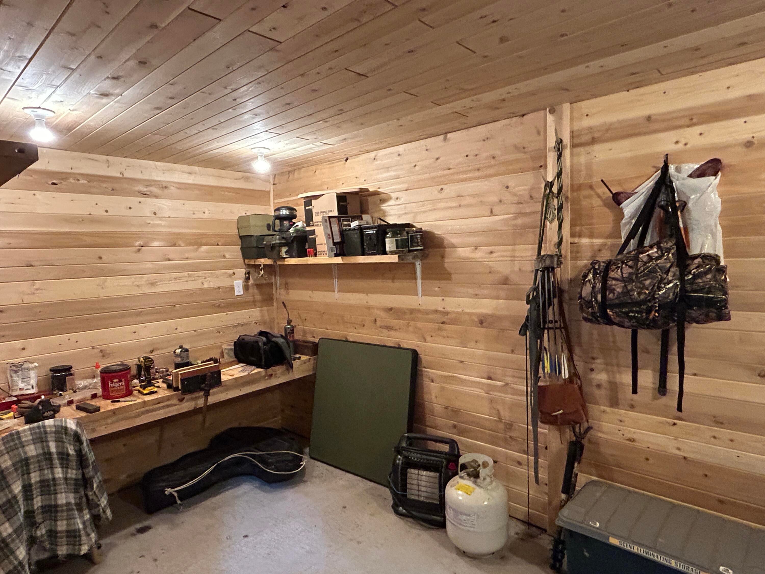 9634 Indian Reserve Road Alpena, MI 49707 - Photo 32 of 38 Workshop inside pole barn