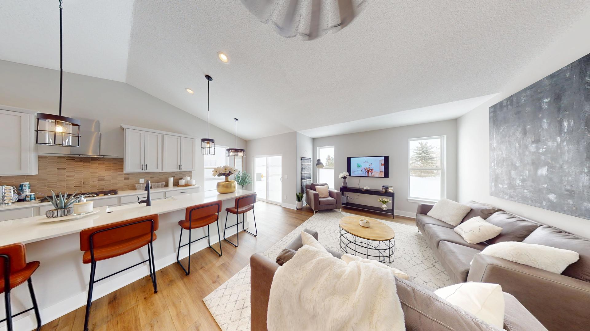 8-4 West Orchid Lane, Unit 4 Channahon, IL 60410 - Photo 6 of 28 a living room with furniture a rug and a flat screen tv