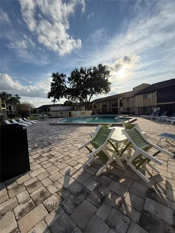a view of swimming pool with seating space