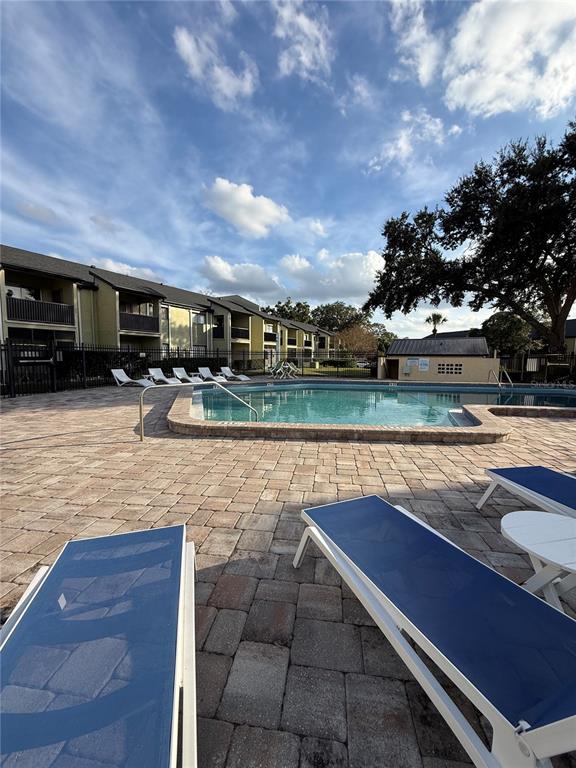 942 Lake Destiny Road, Unit B Altamonte Springs, FL 32714 - Photo 13 of 14 a view of a swimming pool with outdoor seating