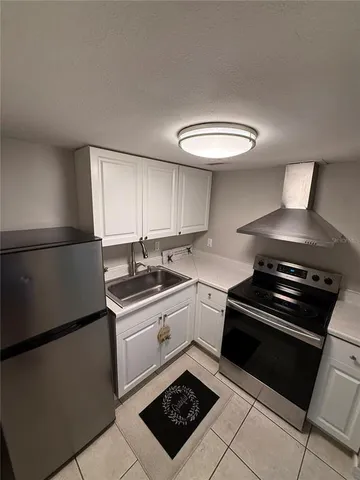 a kitchen with a stove and a sink
