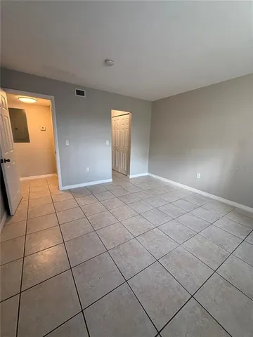 a view of an empty room with a window