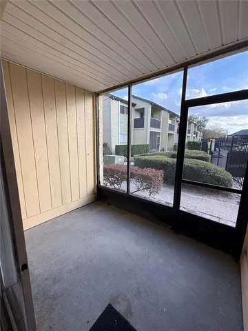 a view of an empty room with a balcony