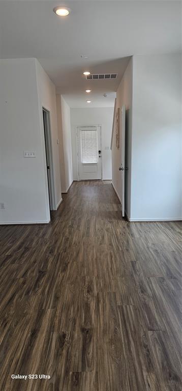 1401 Linwood Street Leander, TX 78641 - Photo 18 of 39 Spare room with dark wood finished floors and recessed lighting