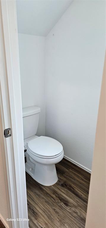 1401 Linwood Street Leander, TX 78641 - Photo 19 of 39 Bathroom featuring wood finished floors and toilet