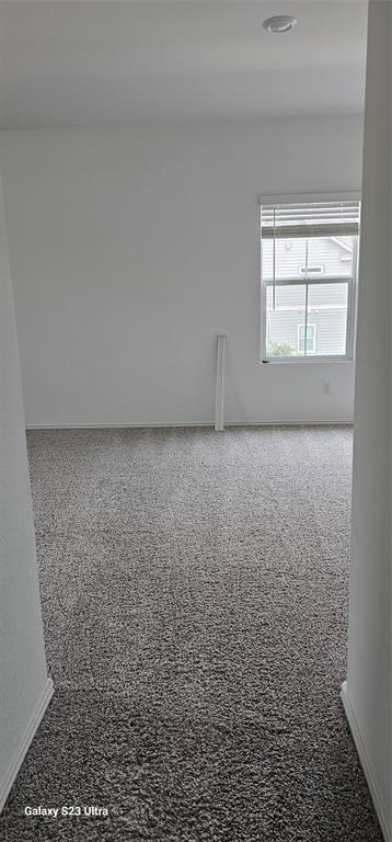1401 Linwood Street Leander, TX 78641 - Photo 22 of 39 Carpeted spare room with baseboards