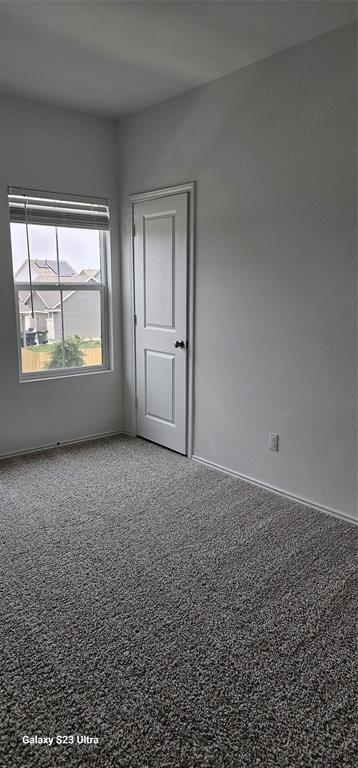 1401 Linwood Street Leander, TX 78641 - Photo 23 of 39 Unfurnished room featuring baseboards and carpet