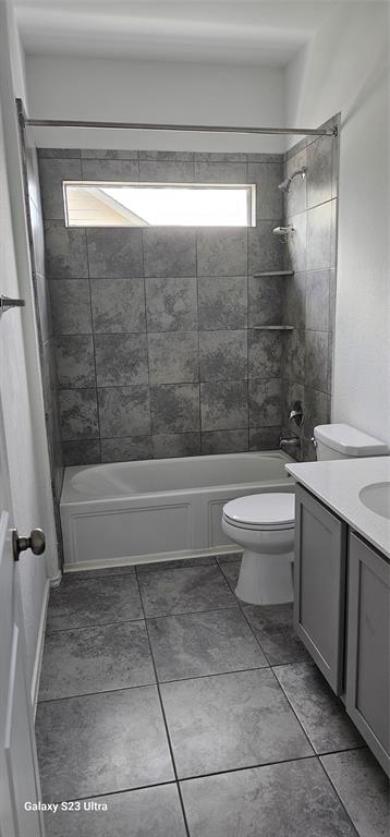 1401 Linwood Street Leander, TX 78641 - Photo 29 of 39 Bathroom with vanity, bathtub / shower combination, and tile patterned floors