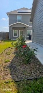 1401 Linwood Street Leander, TX 78641 - Photo 38 of 39 View of side of property featuring a lawn