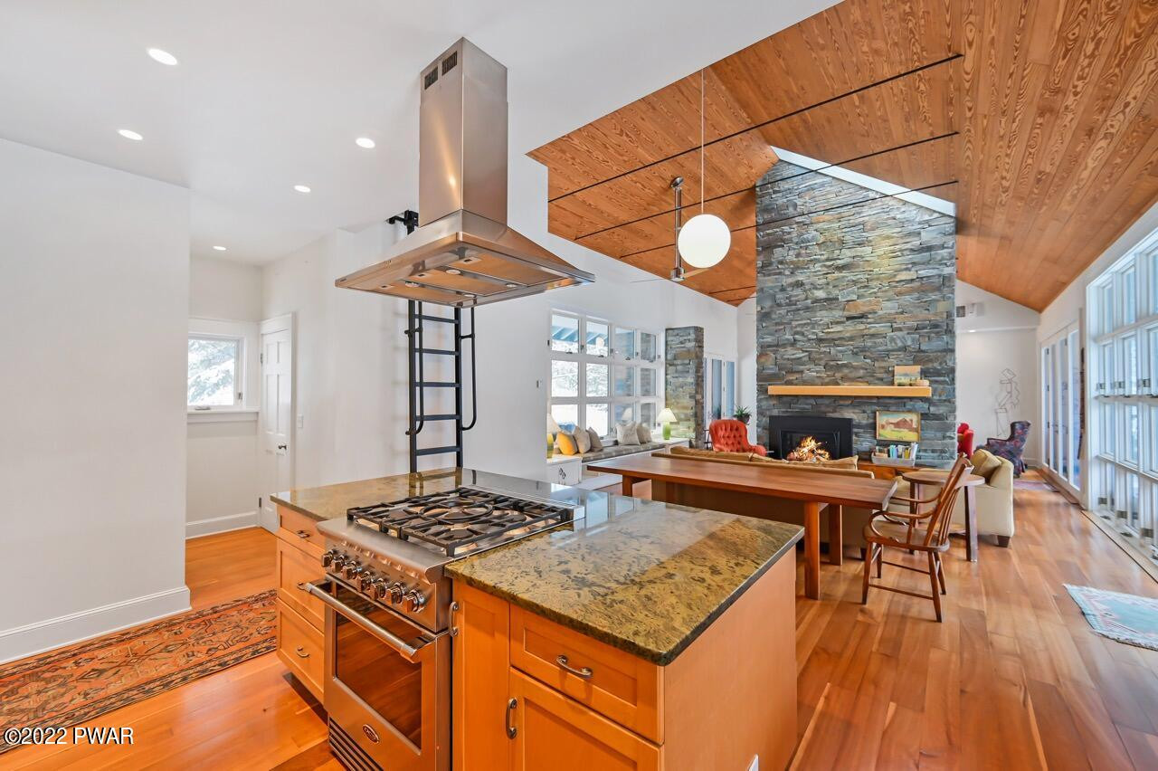 45 Tammany Flats Road Damascus, PA 18415 - Photo 30 of 73 a kitchen with stainless steel appliances granite countertop a stove and a wooden floors