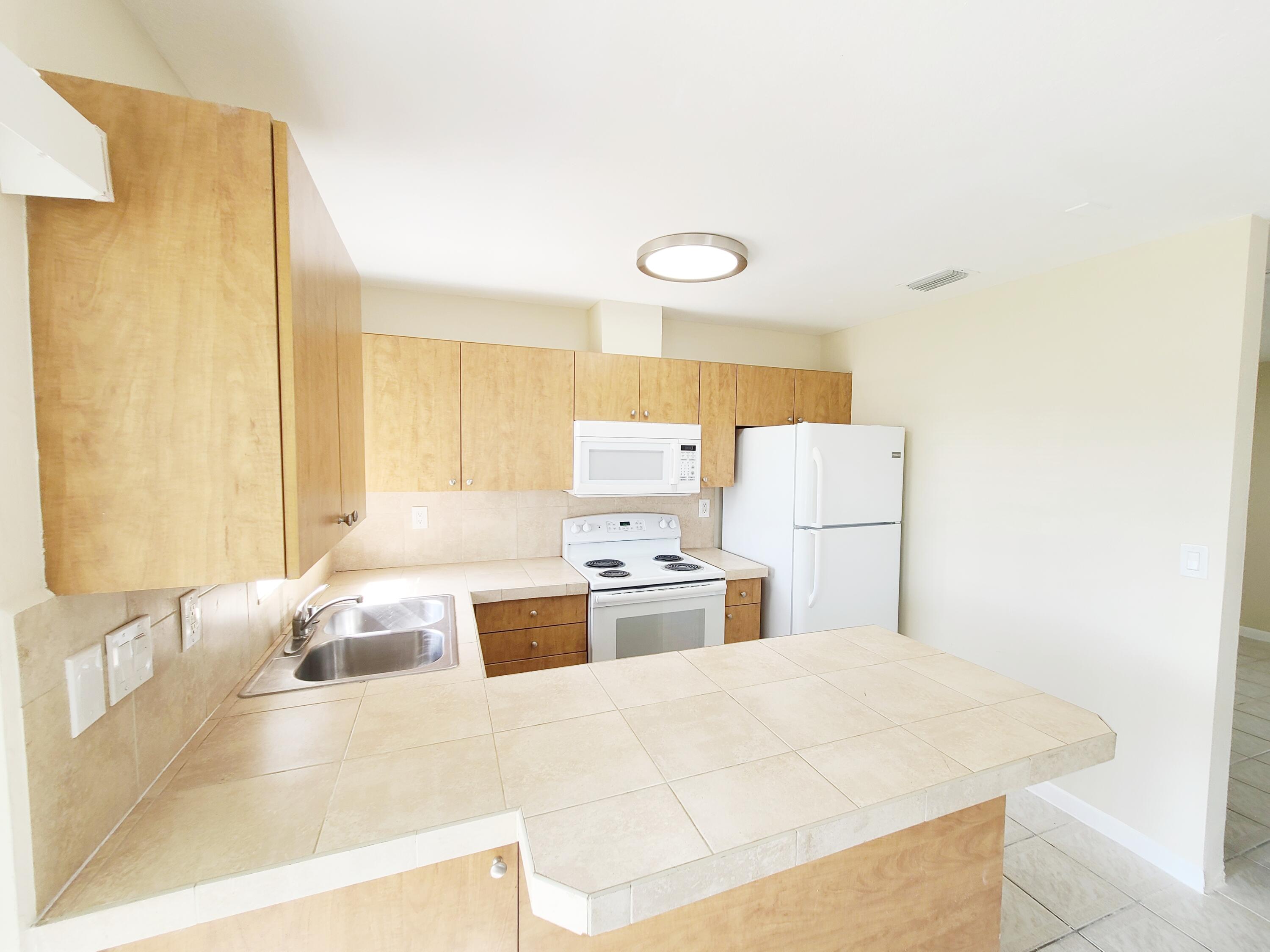 412 Conniston Road, Unit A West Palm Beach, FL 33405 - Photo 9 of 15 20220525_094832-01