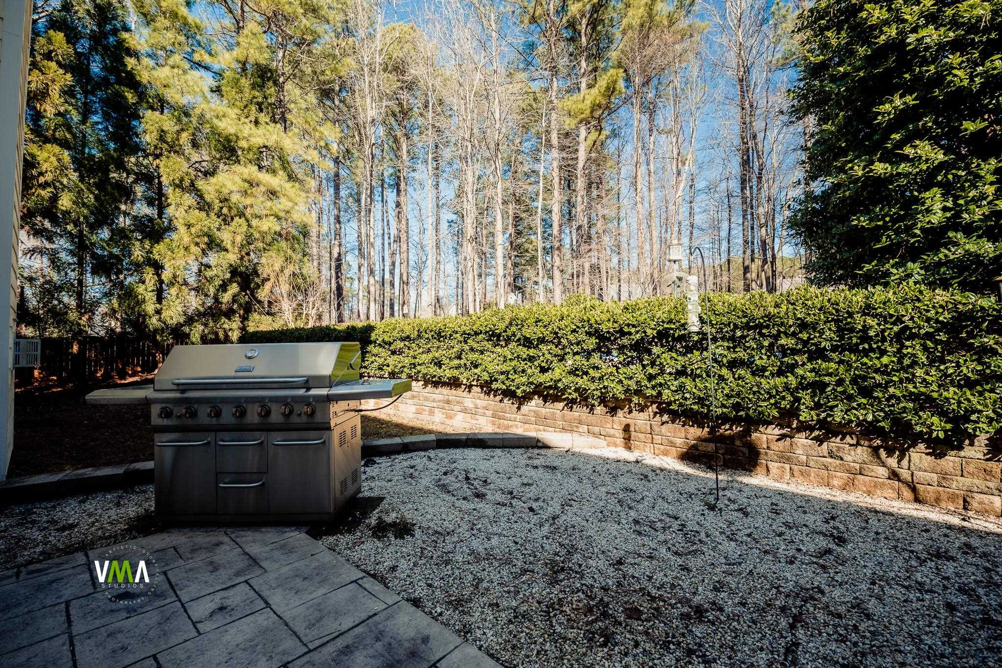 5417 Levering Mill Road Apex, NC 27539 - Photo 9 of 39 patio has propane connection for grill. Grill does not convey with property. Patio/Deck