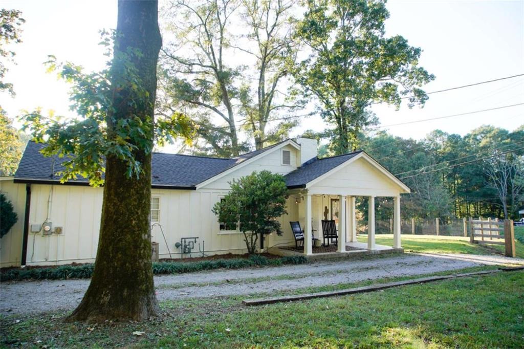 1024 Collard Valley Road Cedartown, GA 30125 - Photo 1 of 1 a front view of a house with a yard