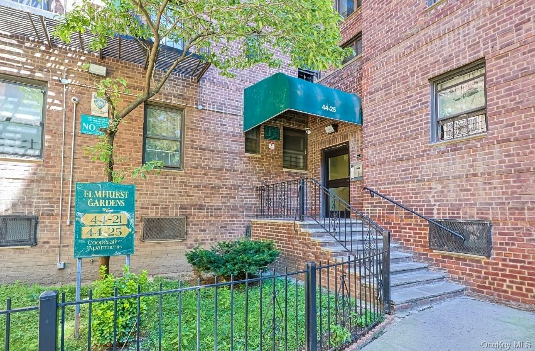 44-25 Macnish Street, Unit 6D Queens, NY 11373 - Photo 1 of 20 a front view of a house with a garden