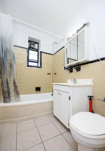 a bathroom with a sink a toilet and bathtub