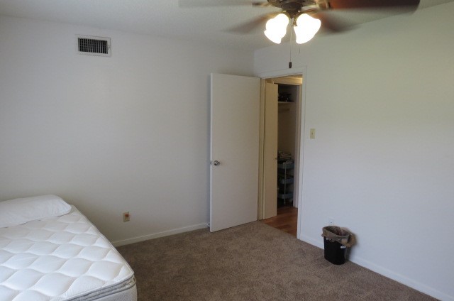 1917 20th Street, Unit 3 Huntsville, TX 77340 - Photo 6 of 18 a view of a livingroom with a chandelier