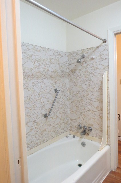 1917 20th Street, Unit 3 Huntsville, TX 77340 - Photo 10 of 18 a bathroom with a bathtub and a shower