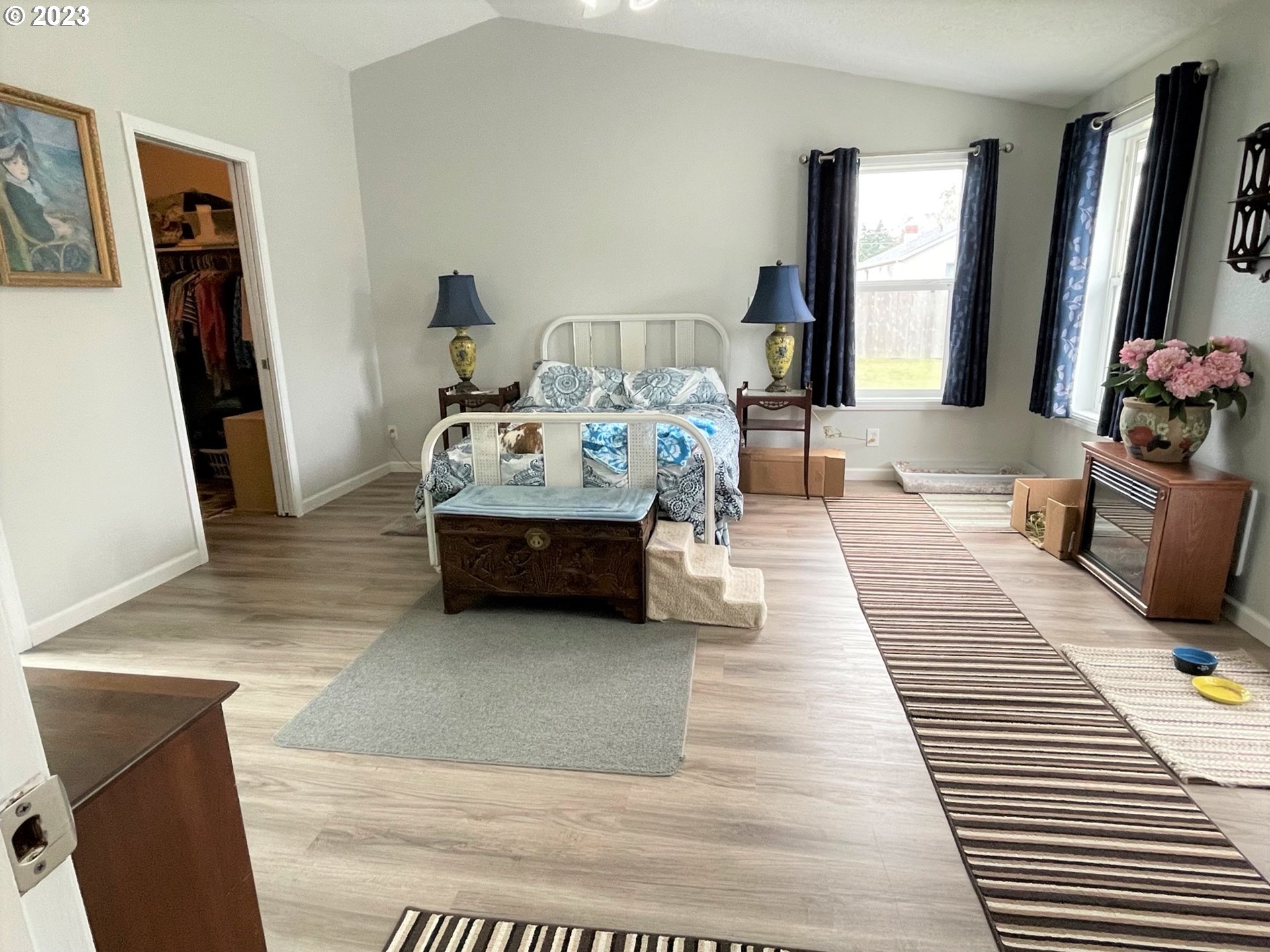 2035 16th Street Florence, OR 97439 - Photo 12 of 30 a living room with furniture hard wood floor and a flat screen tv