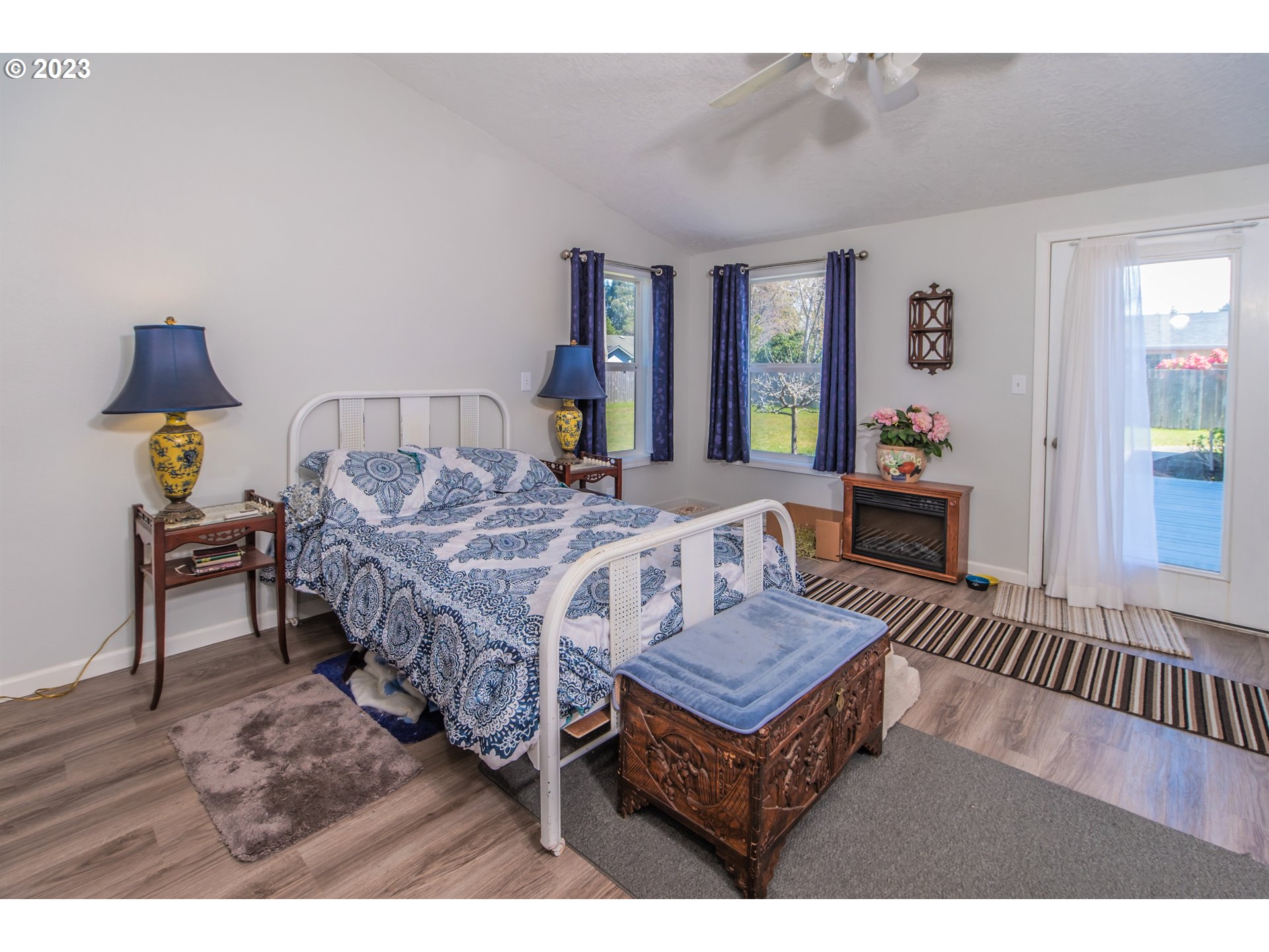 2035 16th Street Florence, OR 97439 - Photo 13 of 30 a living room with a bed furniture and next to a window