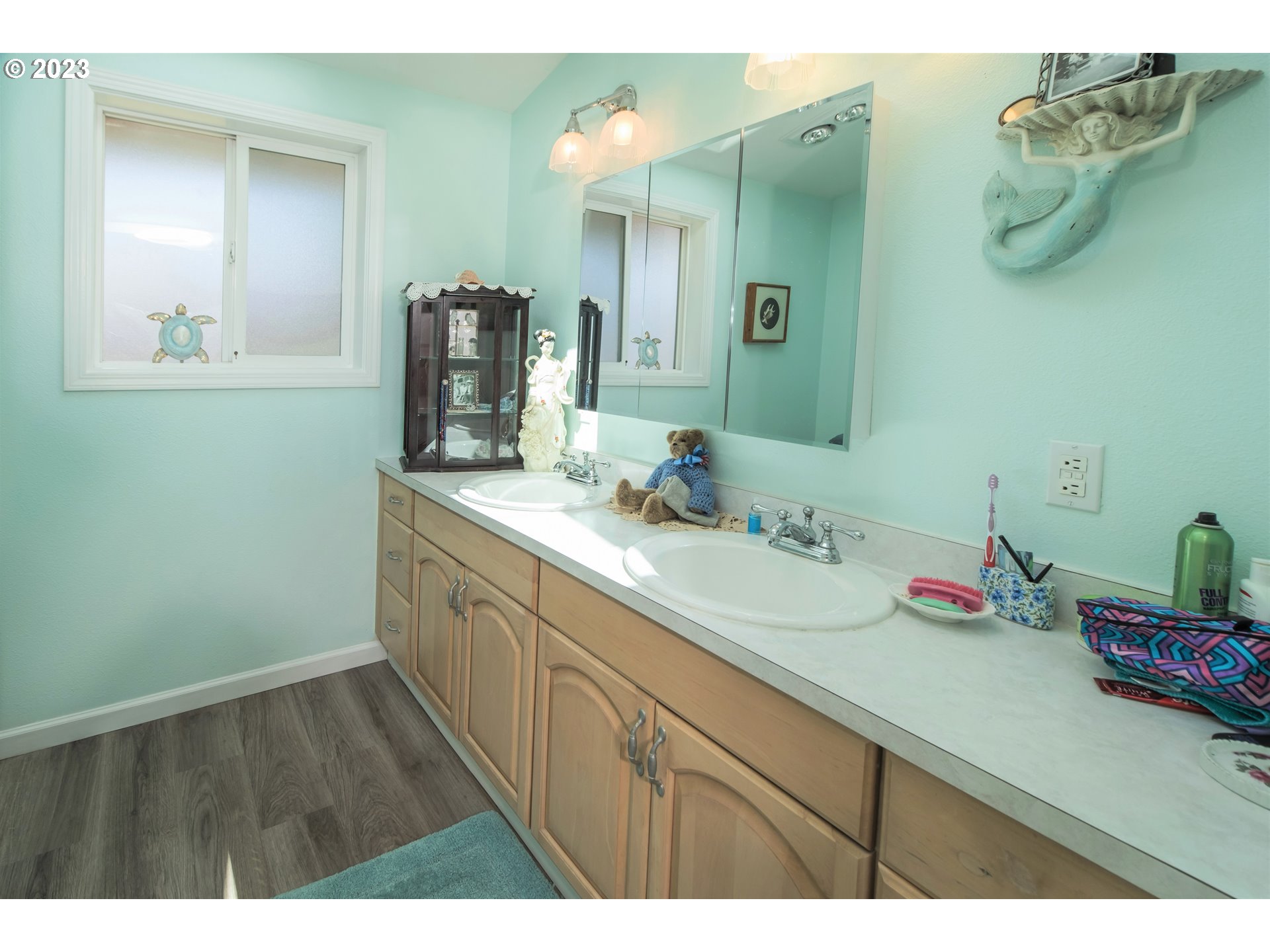 2035 16th Street Florence, OR 97439 - Photo 14 of 30 a bathroom with a sink and a mirror