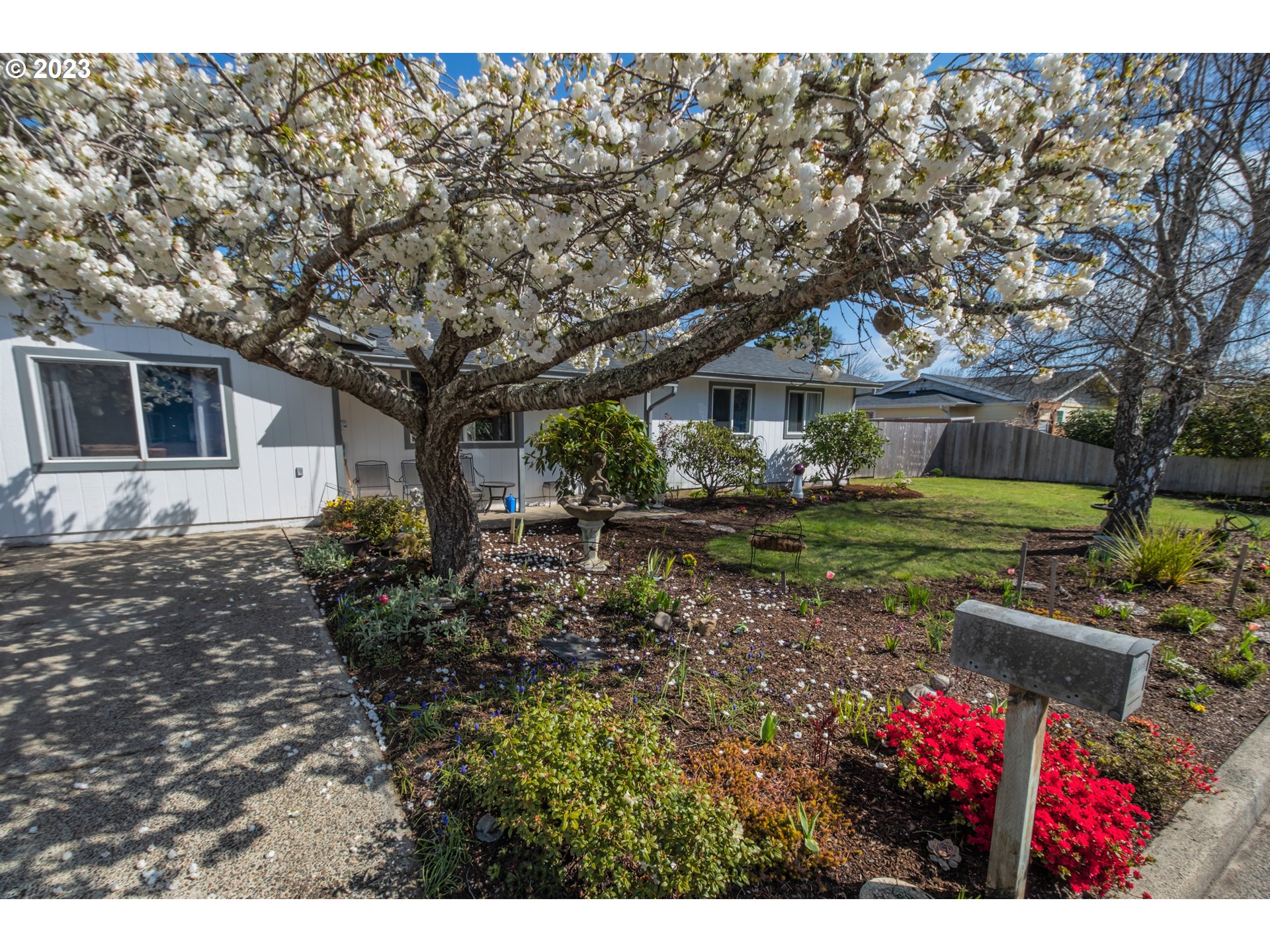 2035 16th Street Florence, OR 97439 - Photo 27 of 30 a view of house with yard