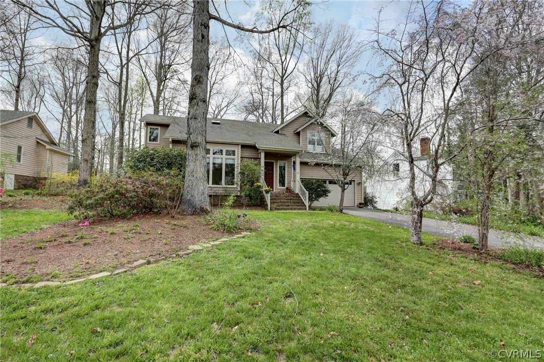 13708 Sandy Oak Road Chester, VA 23831 - Photo 27 of 32 a view of a house with backyard and a tree
