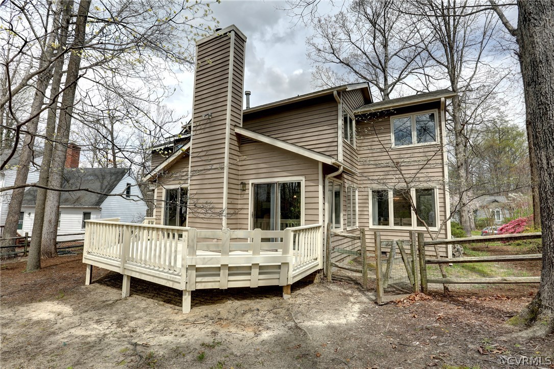 13708 Sandy Oak Road Chester, VA 23831 - Photo 29 of 32 a view of a house with a yard and wooden fence