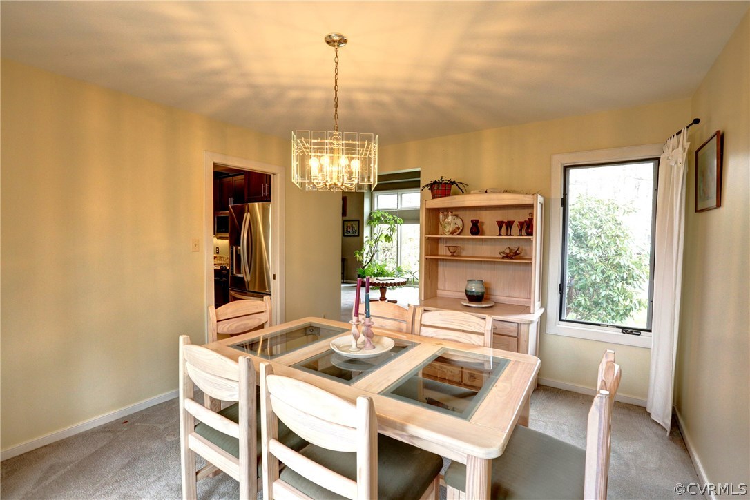 13708 Sandy Oak Road Chester, VA 23831 - Photo 6 of 32 a view of a dining room with furniture window and outside view