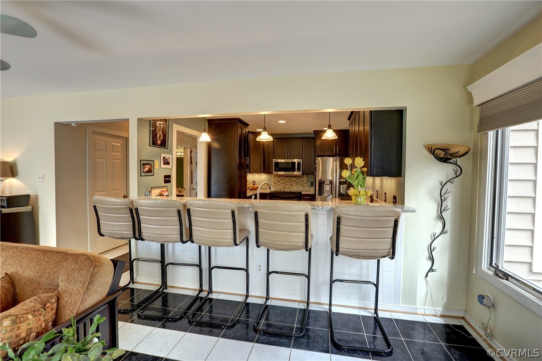 13708 Sandy Oak Road Chester, VA 23831 - Photo 9 of 32 a dining room with furniture and window