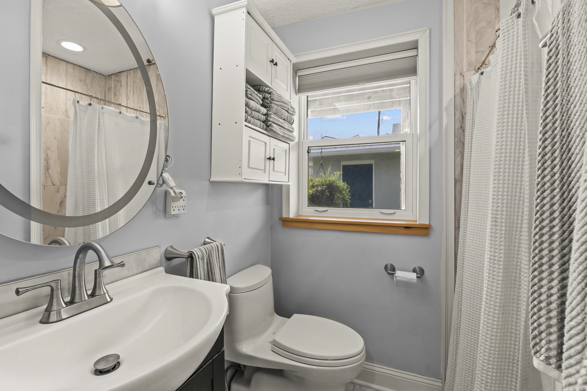 7 16th Street St. Augustine, FL 32080 - Photo 15 of 61 a bathroom with a sink a toilet and a mirror