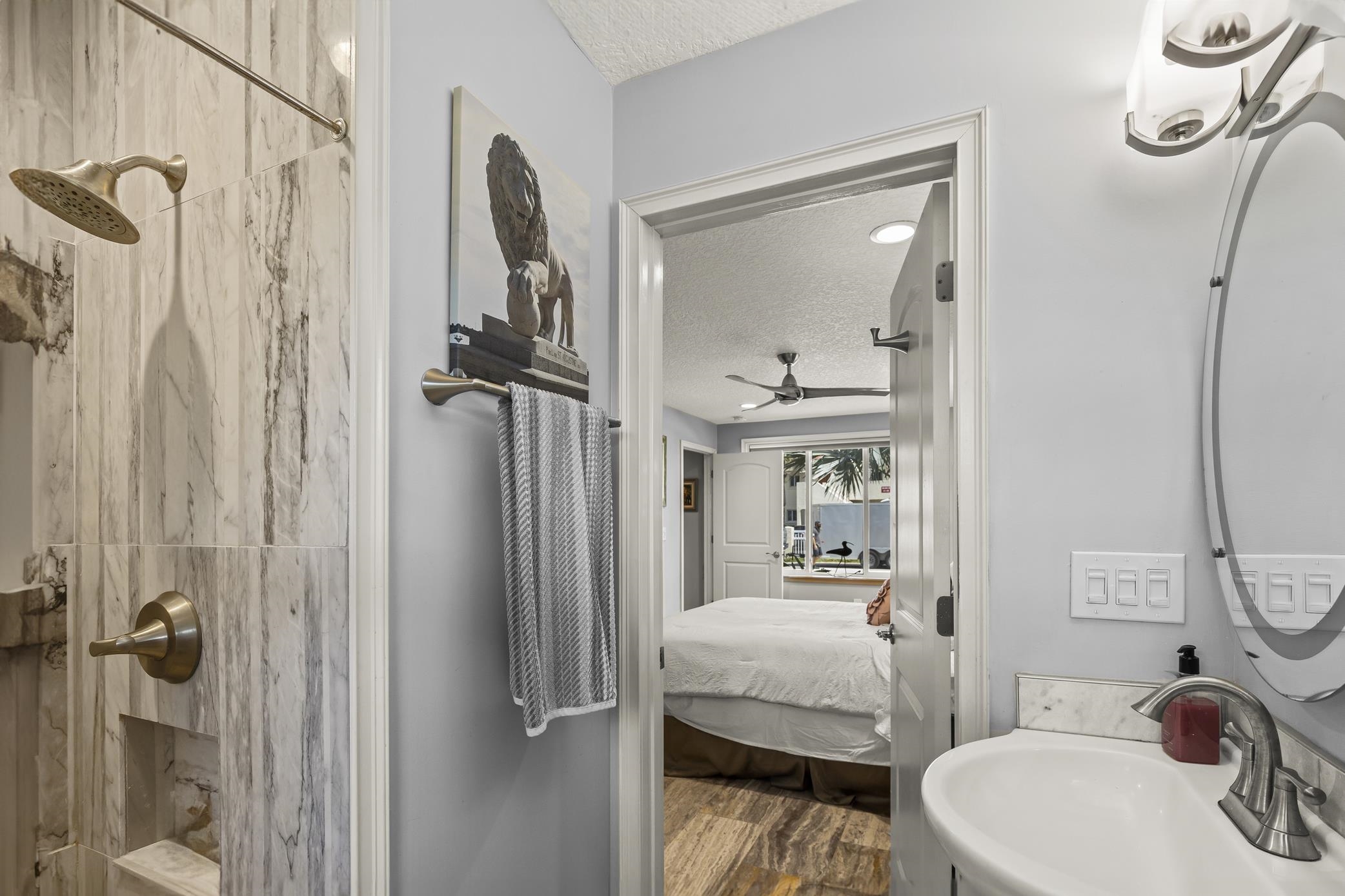 7 16th Street St. Augustine, FL 32080 - Photo 16 of 61 a en suite bathroom with a sink and a mirror