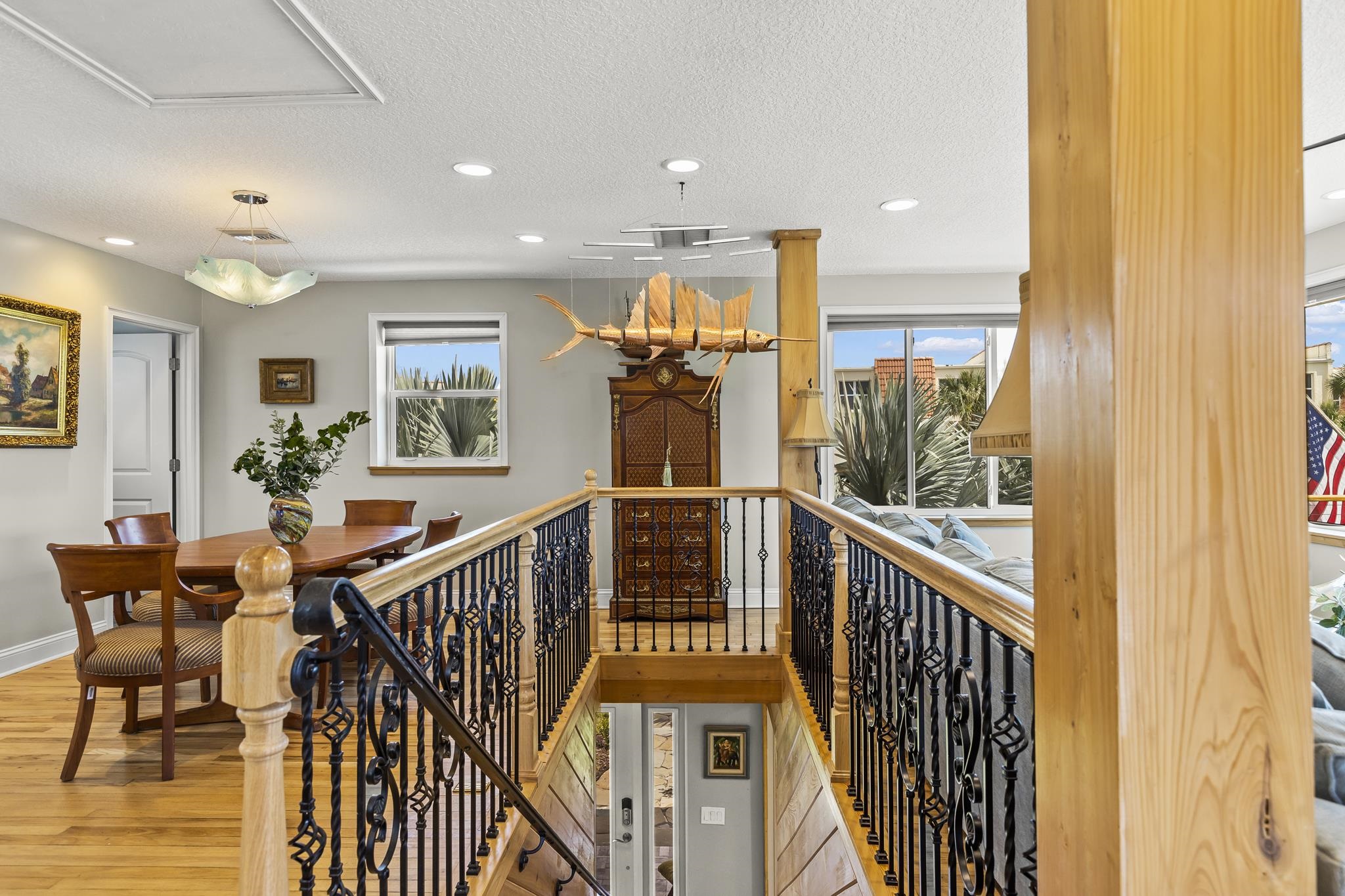 7 16th Street St. Augustine, FL 32080 - Photo 29 of 61 a view of a hallway with wooden floor and furniture