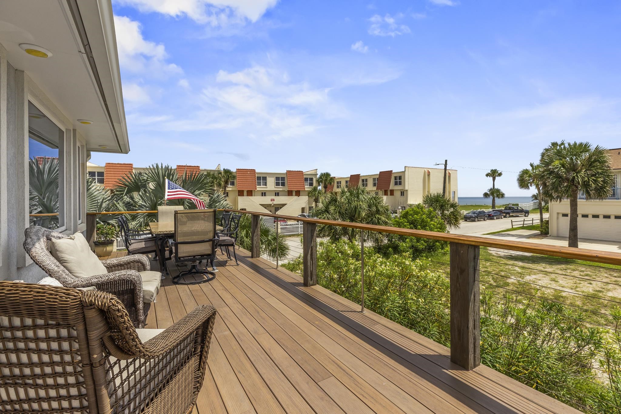 7 16th Street St. Augustine, FL 32080 - Photo 44 of 61 a view of a balcony with two chairs and a table