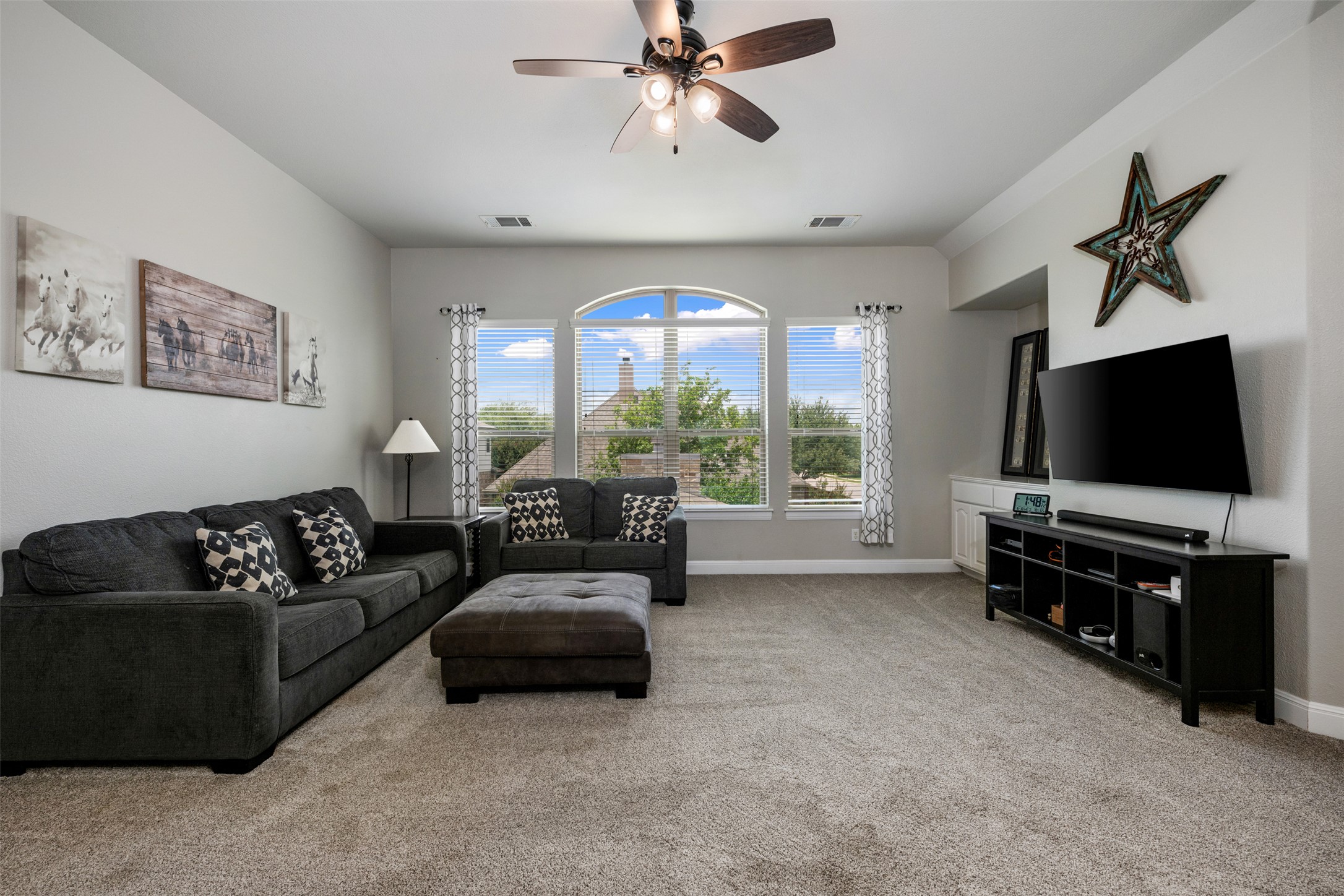 3021 Wedgescale Pass Leander, TX 78641 - Photo 18 of 40 a living room with furniture and a flat screen tv