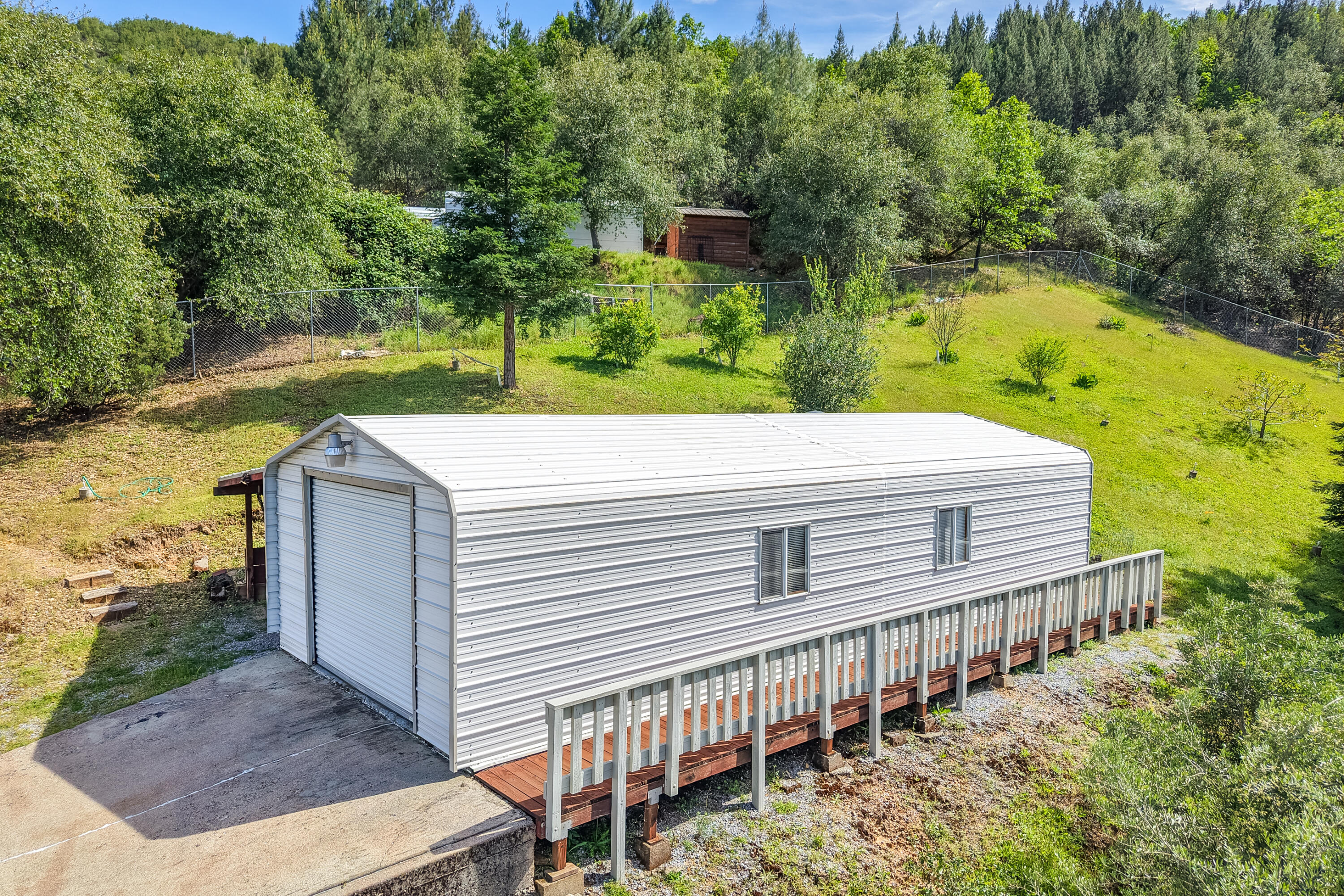 22151 Ravine Court Redding, CA 96003 - Photo 3 of 34 a view of a house with a yard