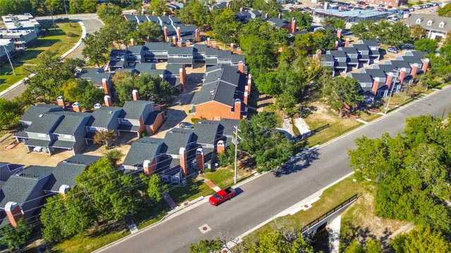 an aerial view of residential houses with outdoor space