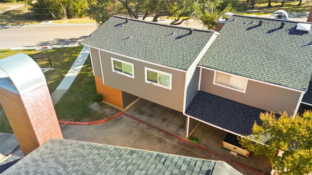 a aerial view of a house with a yard