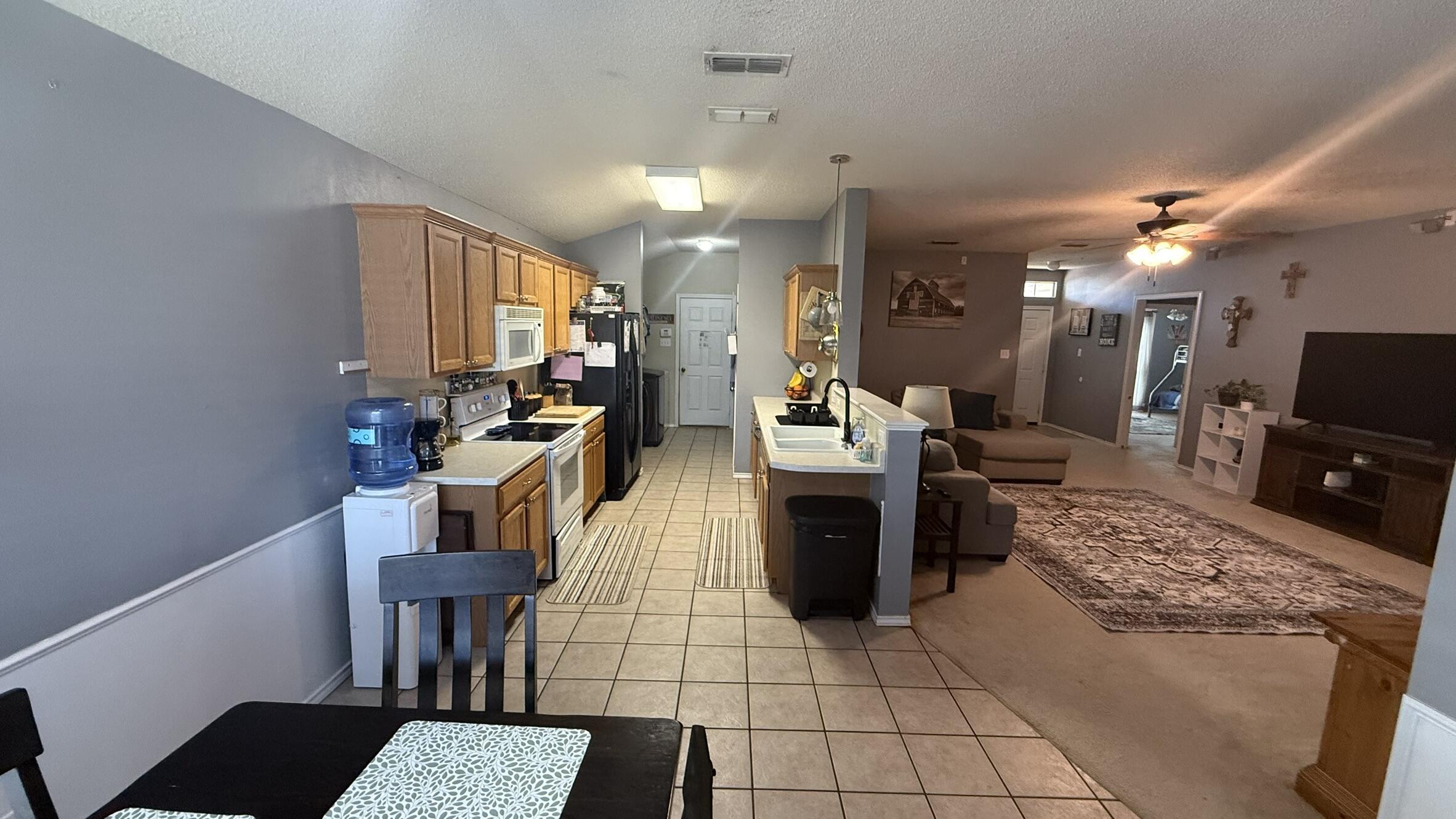6808 84th Street Lubbock, TX 79424 - Photo 3 of 11 a view of a workspace with furniture