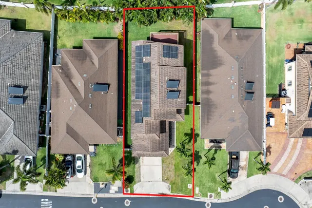 an aerial view of a house with outdoor space and street view