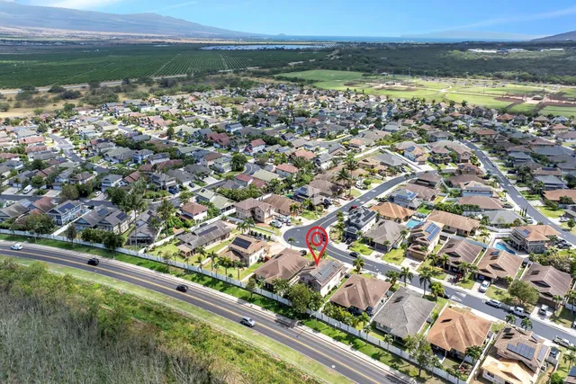 an aerial view of residential building and lake
