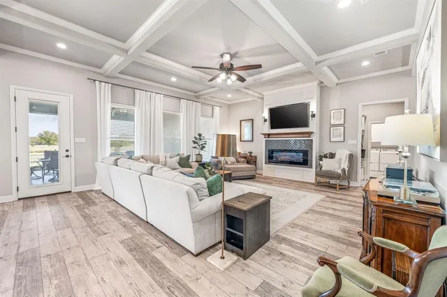 a living room with furniture fireplace and flat screen tv