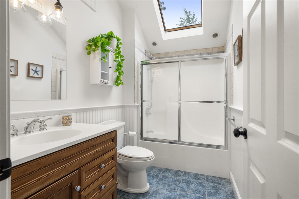 24 Cross Street Harwich, MA 02646 - Photo 14 of 34 a bathroom with a sink a toilet and shower
