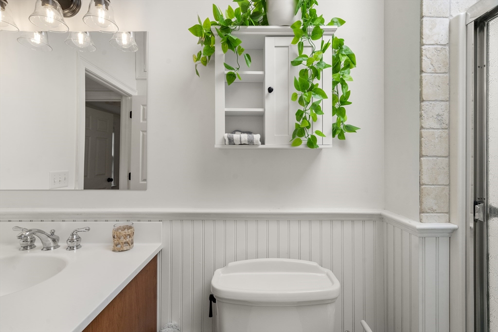 24 Cross Street Harwich, MA 02646 - Photo 15 of 34 a bathroom with a sink and a mirror