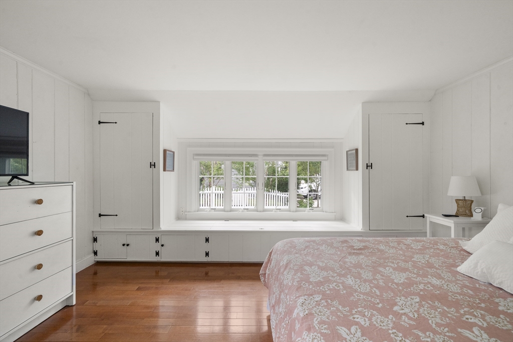 24 Cross Street Harwich, MA 02646 - Photo 17 of 34 a bedroom with a bed and a window