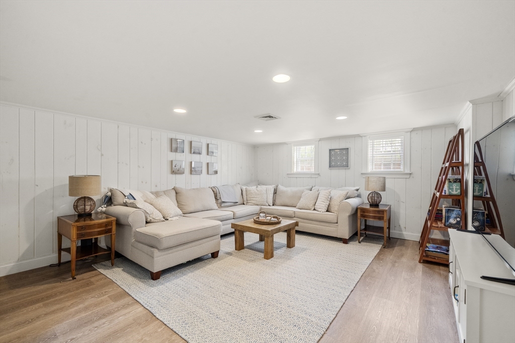 24 Cross Street Harwich, MA 02646 - Photo 20 of 34 a living room with furniture and a wooden floor