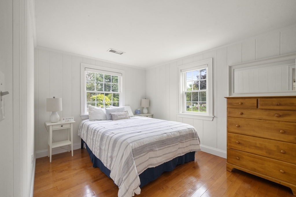 24 Cross Street Harwich, MA 02646 - Photo 6 of 34 a bedroom with a bed and a dresser