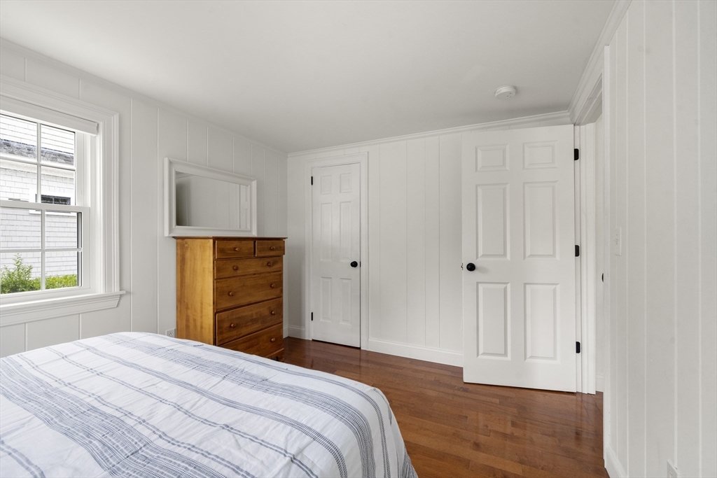 24 Cross Street Harwich, MA 02646 - Photo 7 of 34 a bedroom with a bed and a window