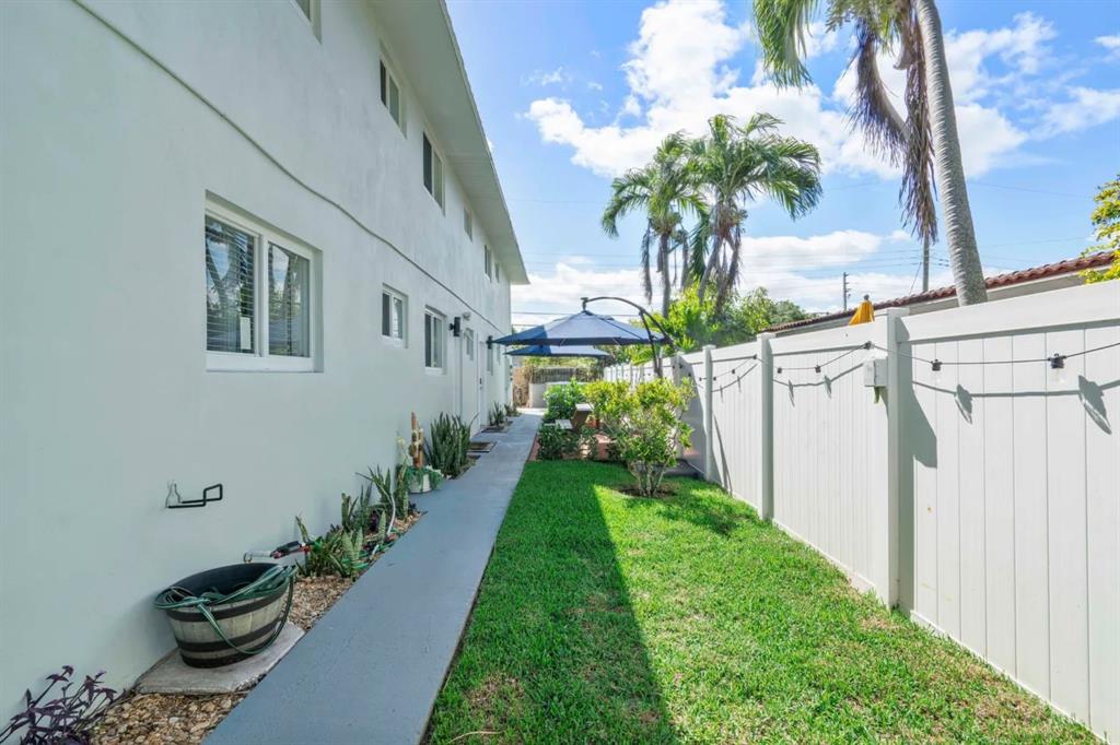 2250 Southeast 5th Street, Unit 6 Pompano Beach, FL 33062 - Photo 9 of 11 a view of a back yard of the house