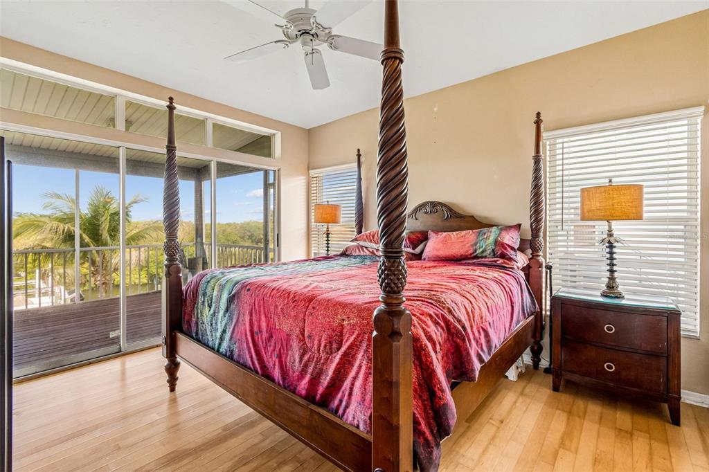 119 Burns Road Terra Ceia, FL 34250 - Photo 38 of 100 a bedroom with a bed and wooden floor